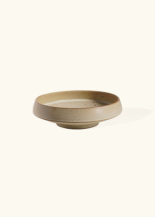 Handmade stoneware wide dish, measuring W19cm x H5cm. A trio of stoneware minimalism, including a flat, deep, and wide dish, each representing timelessness. Perfect for culinary creations, the Stone Dish Set offers versatility and beauty where simplistic design meets functionality.