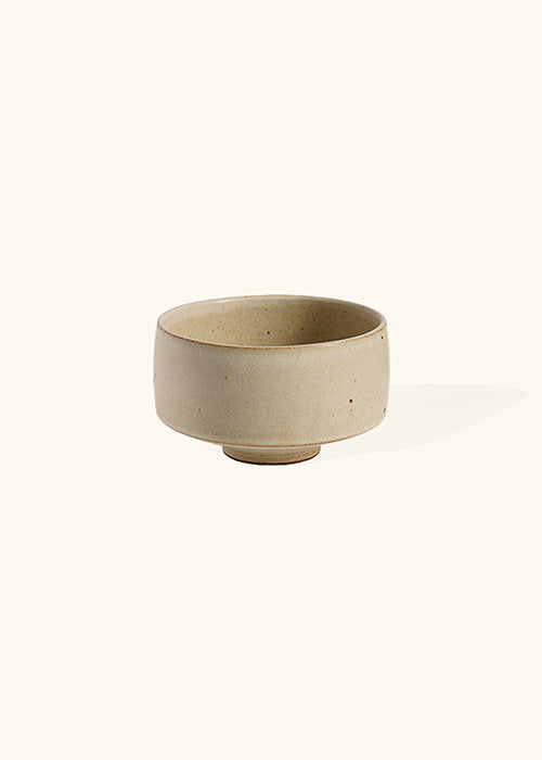 Handmade stoneware deep dish, measuring W12cm x H7.5cm. This collection of stoneware minimalism includes a flat, deep, and wide dish, each representing timelessness. Perfect for culinary creations, the Stone Dish Set offers versatility and beauty where simplistic design meets functionality.