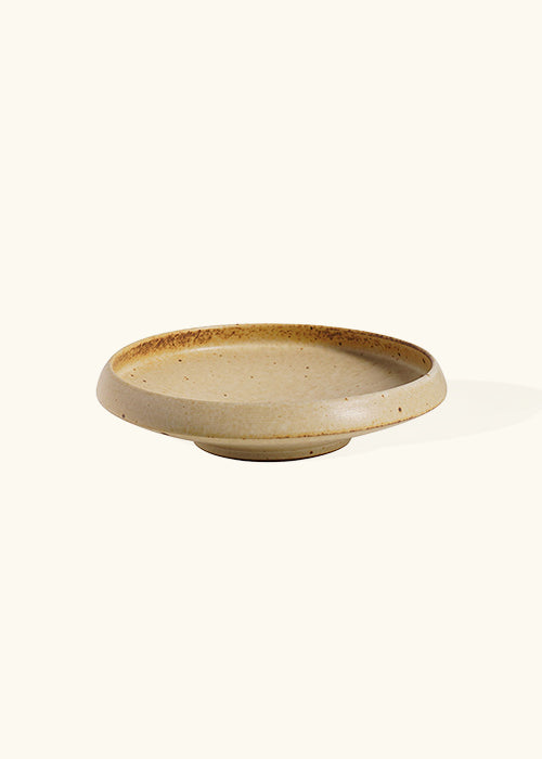 Handmade stoneware flat dish, measuring W16.5cm x H4.3cm. A trio of stoneware minimalism, including a flat, deep, and wide dish, each representing timelessness. Perfect for culinary creations, the Stone Dish Set offers versatility and beauty where simplistic design meets functionality